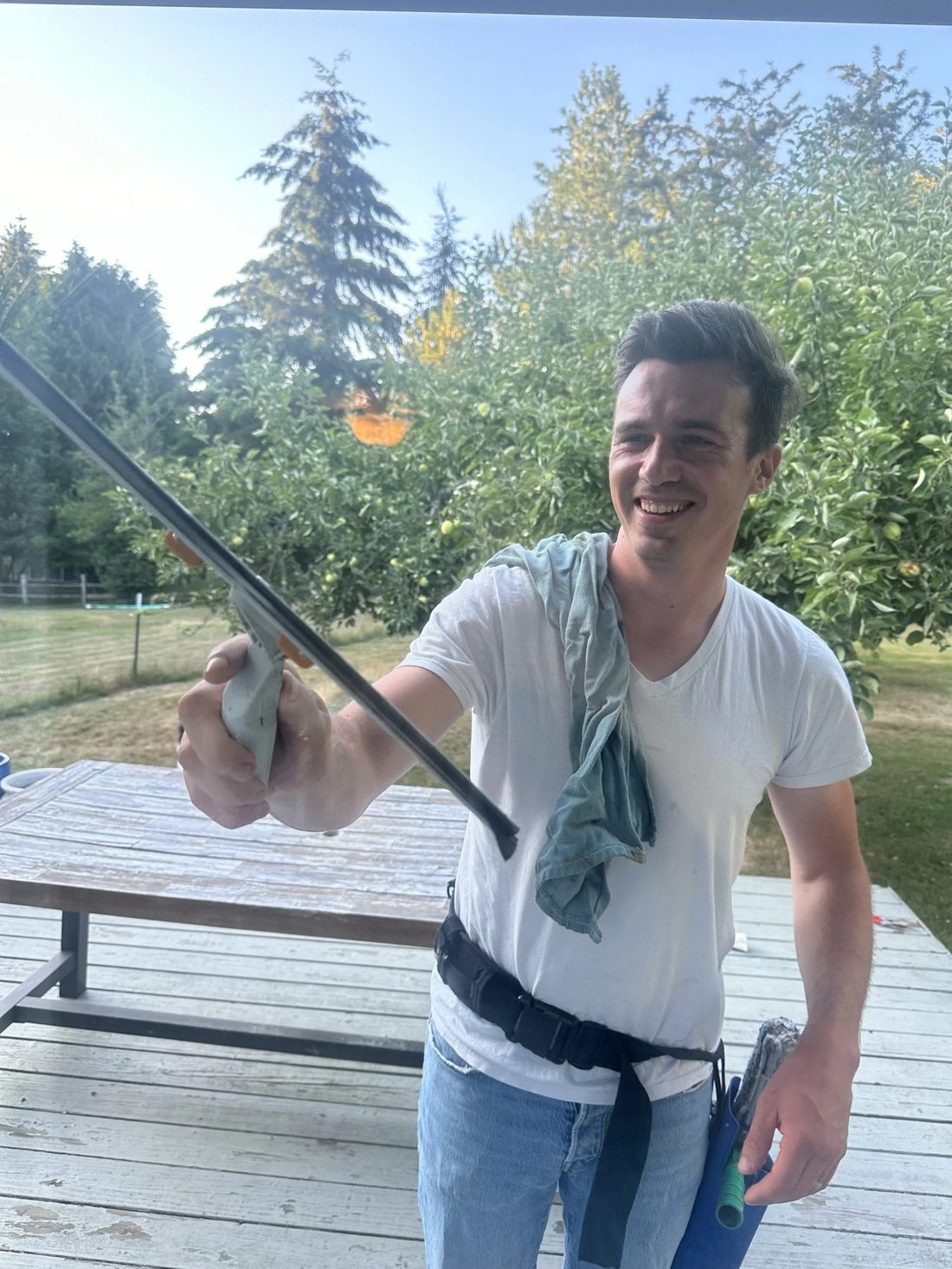 Russell Watland of Northern Services holding a water-fed pole on Vashon Island